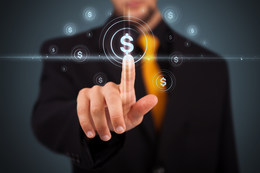 Man pressing virtual dollar sign button