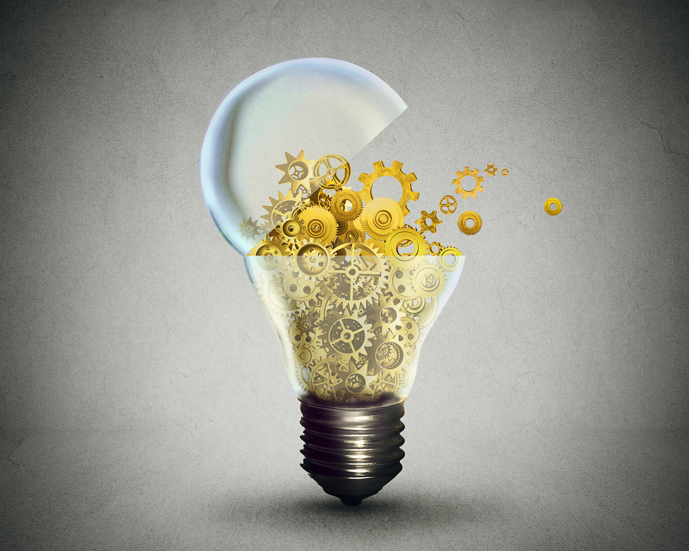 lightbulb with yellow gears spilling out from inside